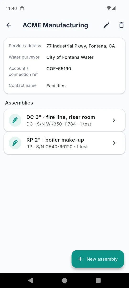 A customer record in BackTest for ACME Manufacturing with service address, water purveyor City of Fontana Water, account number and contact name, above two assemblies: a 3 inch DC fire line and a 2 inch RP boiler make-up