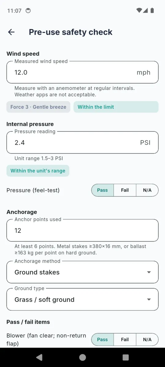 The Pre-use safety check form in BounceLog: a measured wind speed of 12 mph with Force 3 Gentle breeze and Within the limit chips, an internal pressure of 2.4 PSI within the unit range, and 12 anchor points on grass with ground stakes