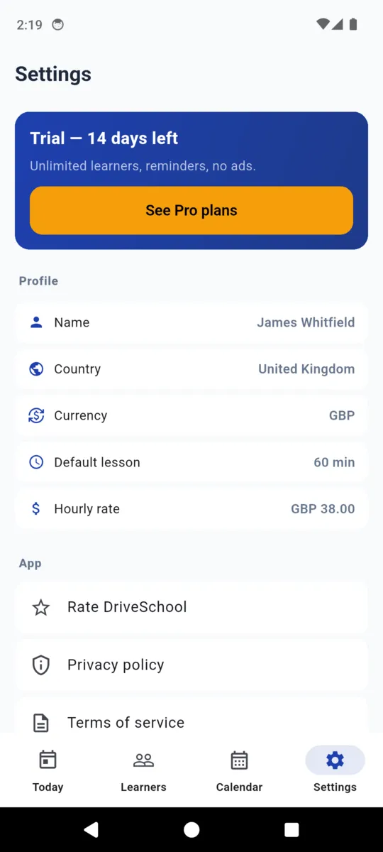 Settings with a trial banner reading 14 days left, then the profile: name James Whitfield, country United Kingdom, currency GBP, default lesson 60 minutes, hourly rate GBP 38, and the Rate DriveSchool, privacy policy and terms rows