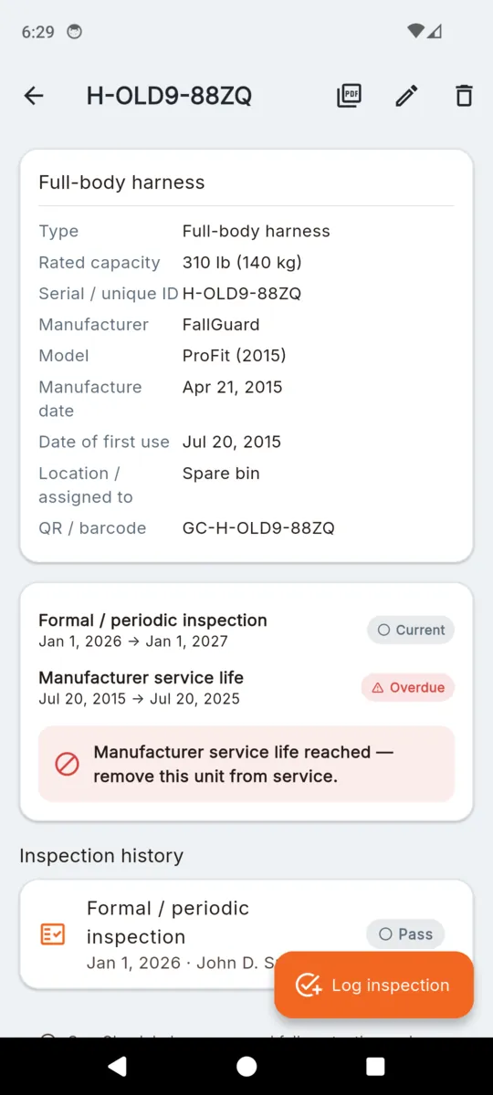 A full-body harness record in GearCheck showing rated capacity, serial, manufacturer, model, manufacture date, first-use date, location and scanned code, above the formal inspection and service-life rows