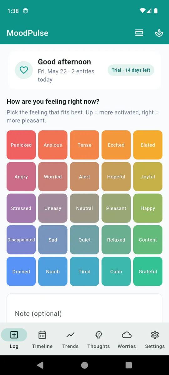 The MoodPulse home screen showing the 25-cell emotion grid tinted red, amber, blue and green, with a note field beneath it