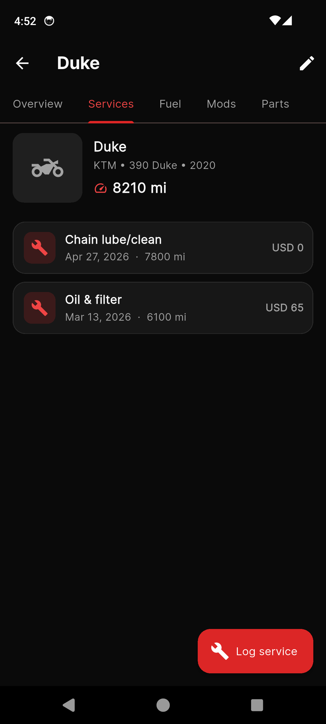 MotoGarage service history with chain and oil entries