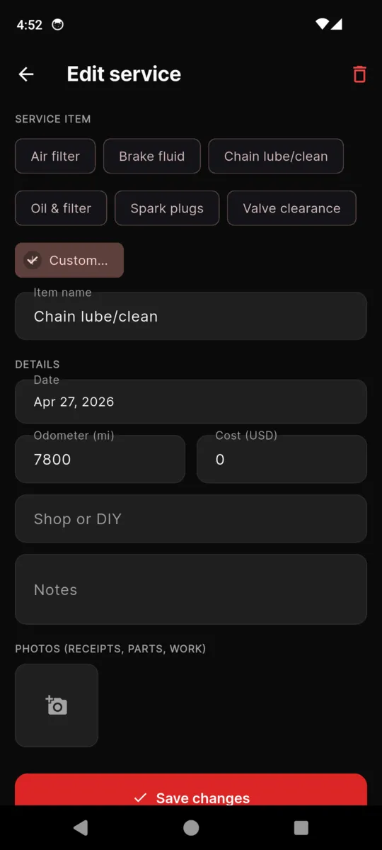 The MotoGarage edit service screen with service item chips, date, odometer, cost, shop or DIY, notes and a photo slot