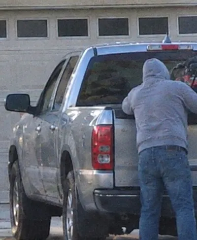 Reference photo of the sample subject, a man in a grey hoodie