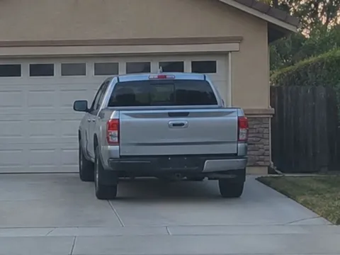 Reference photo of the sample subject vehicle, a silver pickup