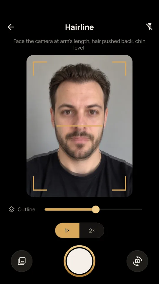 Capture: the earlier hairline photo shows through the camera, with brass corner marks, the level line and an outline slider