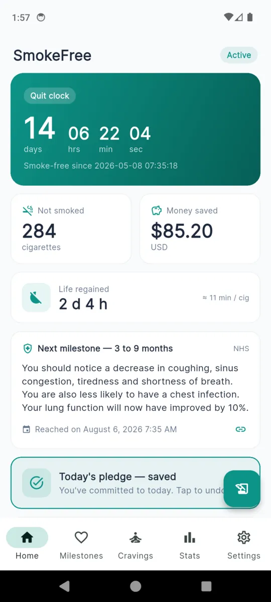 The SmokeFree home screen with a quit clock reading 14 days, tiles for cigarettes not smoked, money saved and life regained, and the next milestone