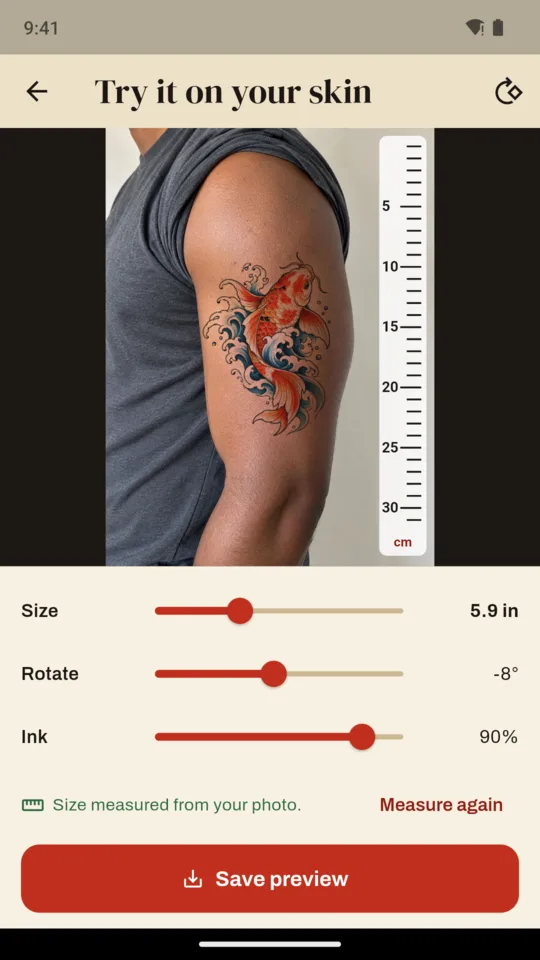 A koi design tried on an upper arm photo, with a ruler and the size, rotate and ink sliders