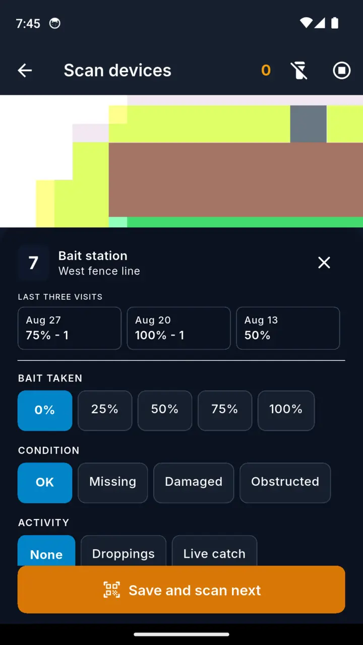 The TrapMatrix scan screen: the camera live on a station tag, with bait taken, condition and activity chips ready below it