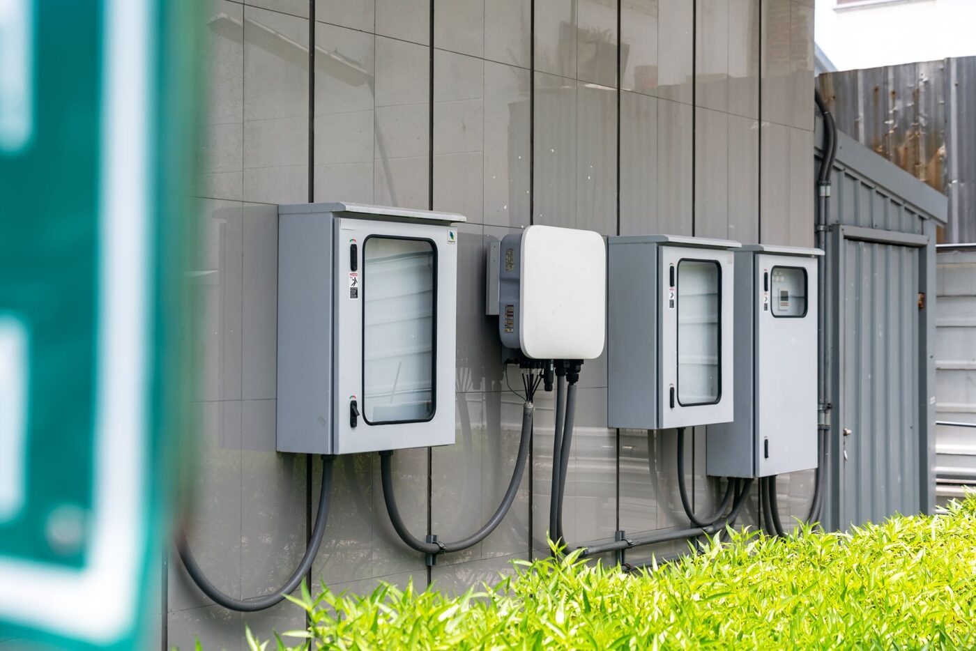 Outdoor electrical enclosures with cabling on a building exterior