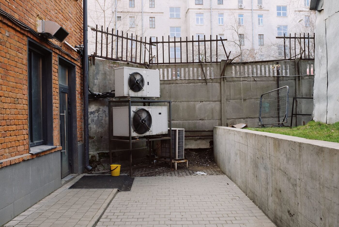 Outdoor air conditioning condenser units against a brick building