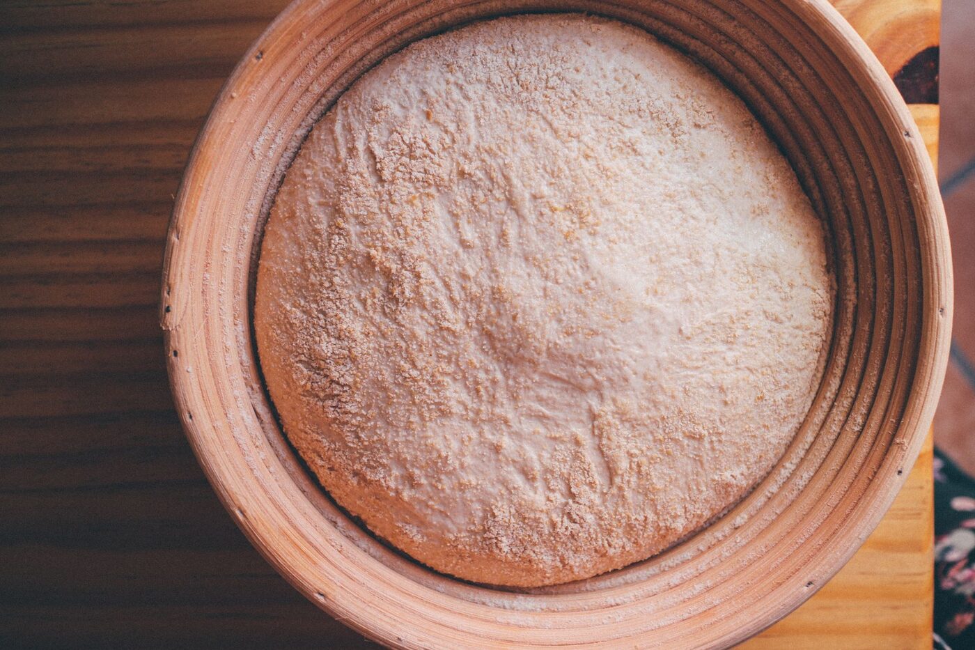 Sourdough dough proving in a round banneton basket